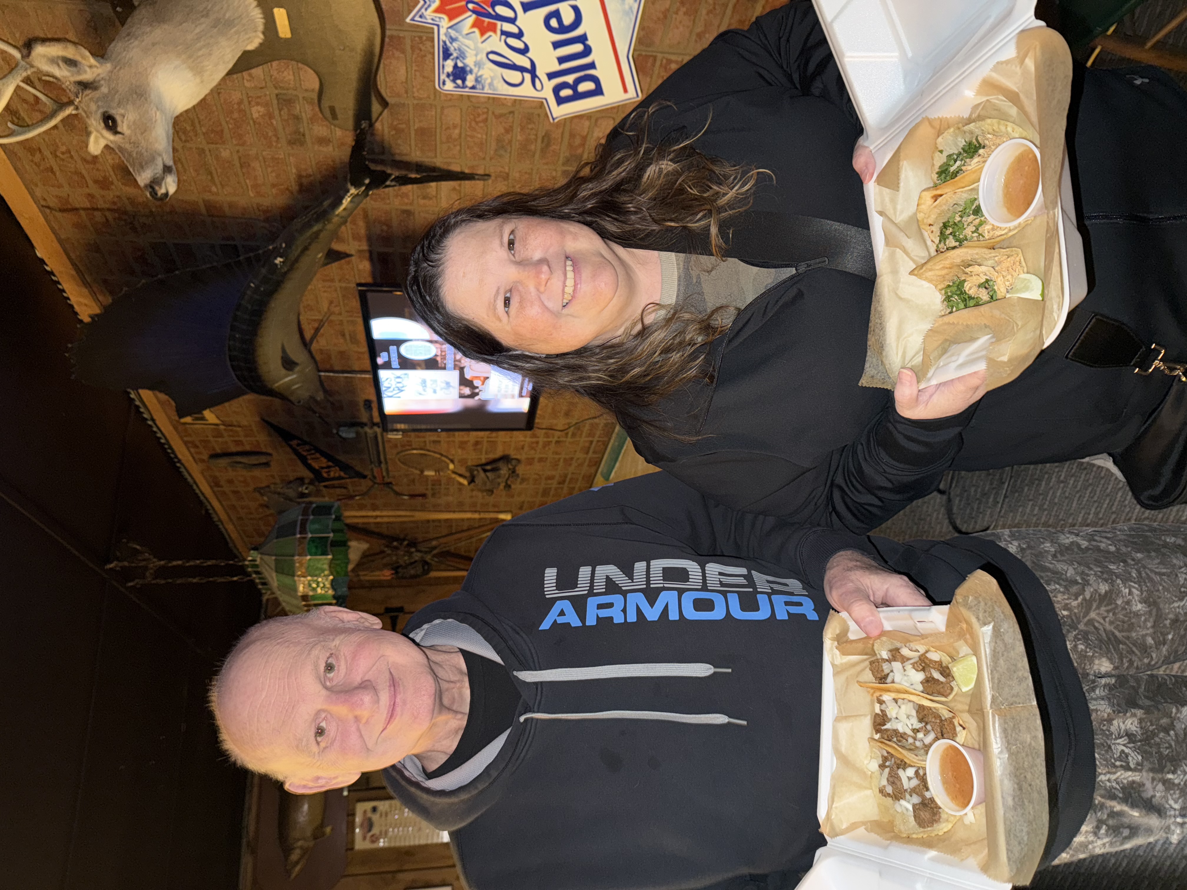 Satisfied customers holding Tailored Tastes taco plates