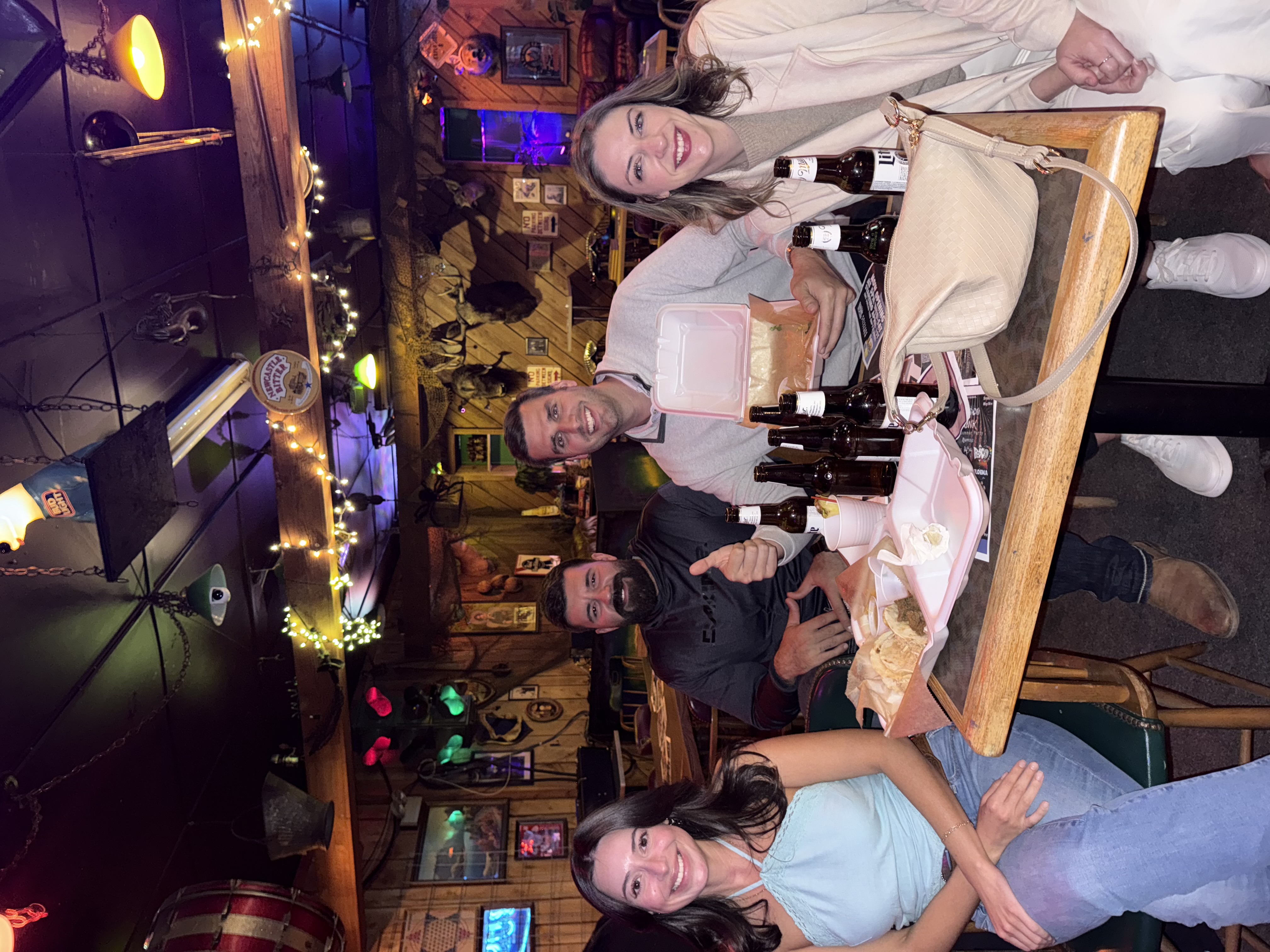 Group of friends enjoying Tailored Tastes food at an event